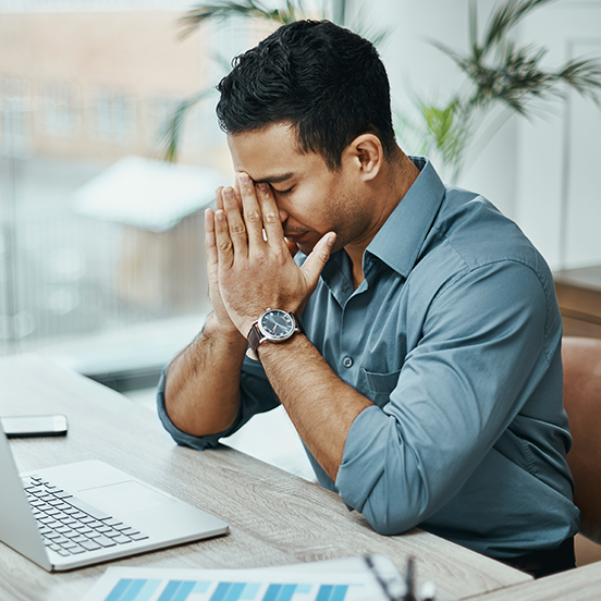 exhausted man at desk