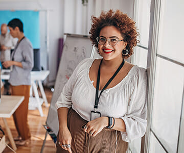 Young woman standing in conference room