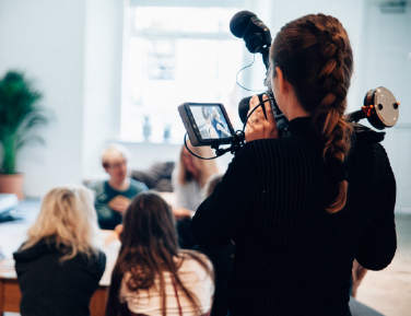 a camerawoman filming