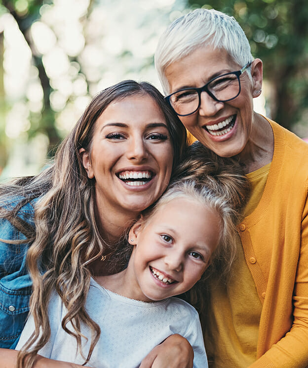 Portrait of happy grandmother, mother and daughter