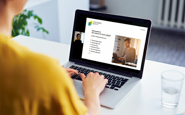 Woman working on laptop at desk