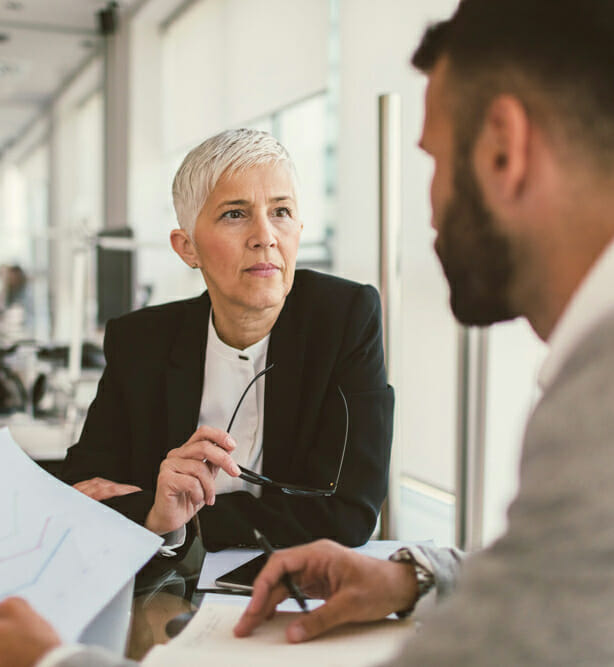 Businesswoman talking to a colleague