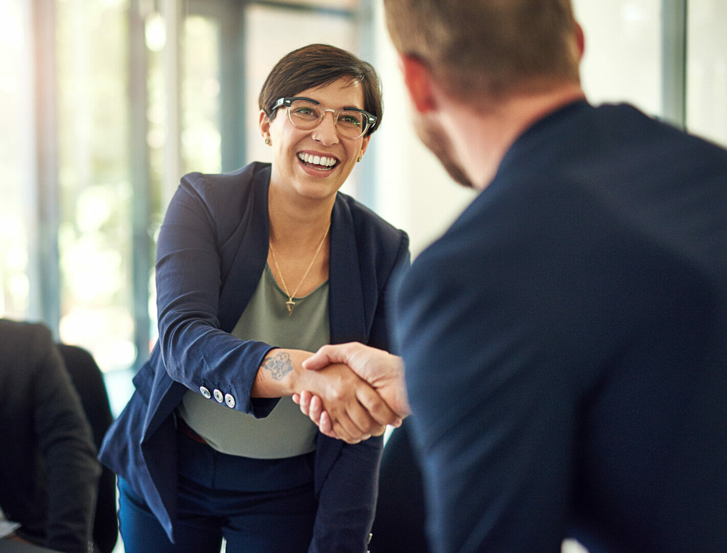 two people shake hands