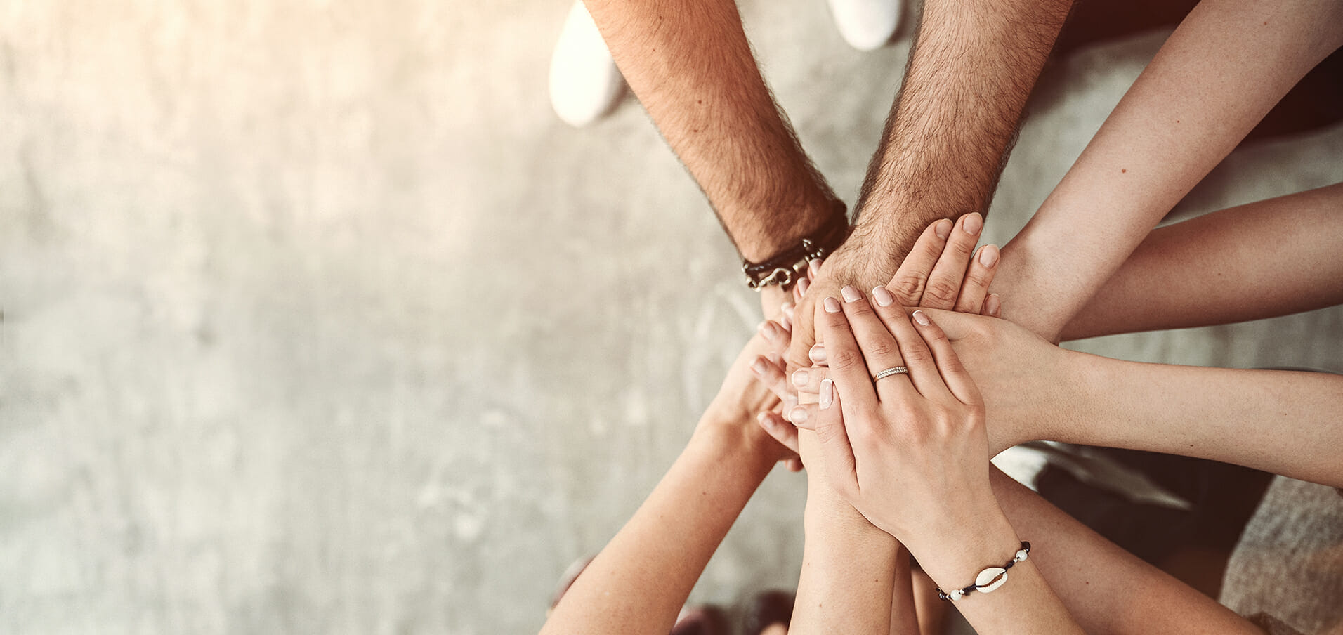 Team stacking their hands together