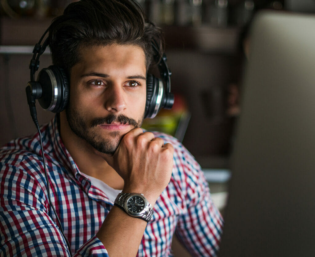 Man with headphones at computer