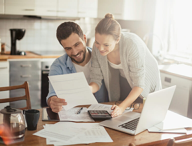 Young couple calculating home finances