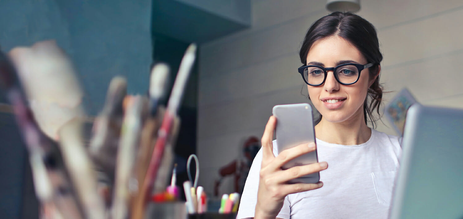 young woman looking at her cell phone