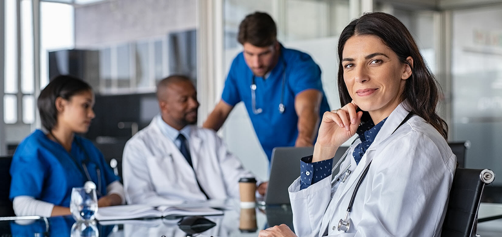 Friendly doctor in a meeting